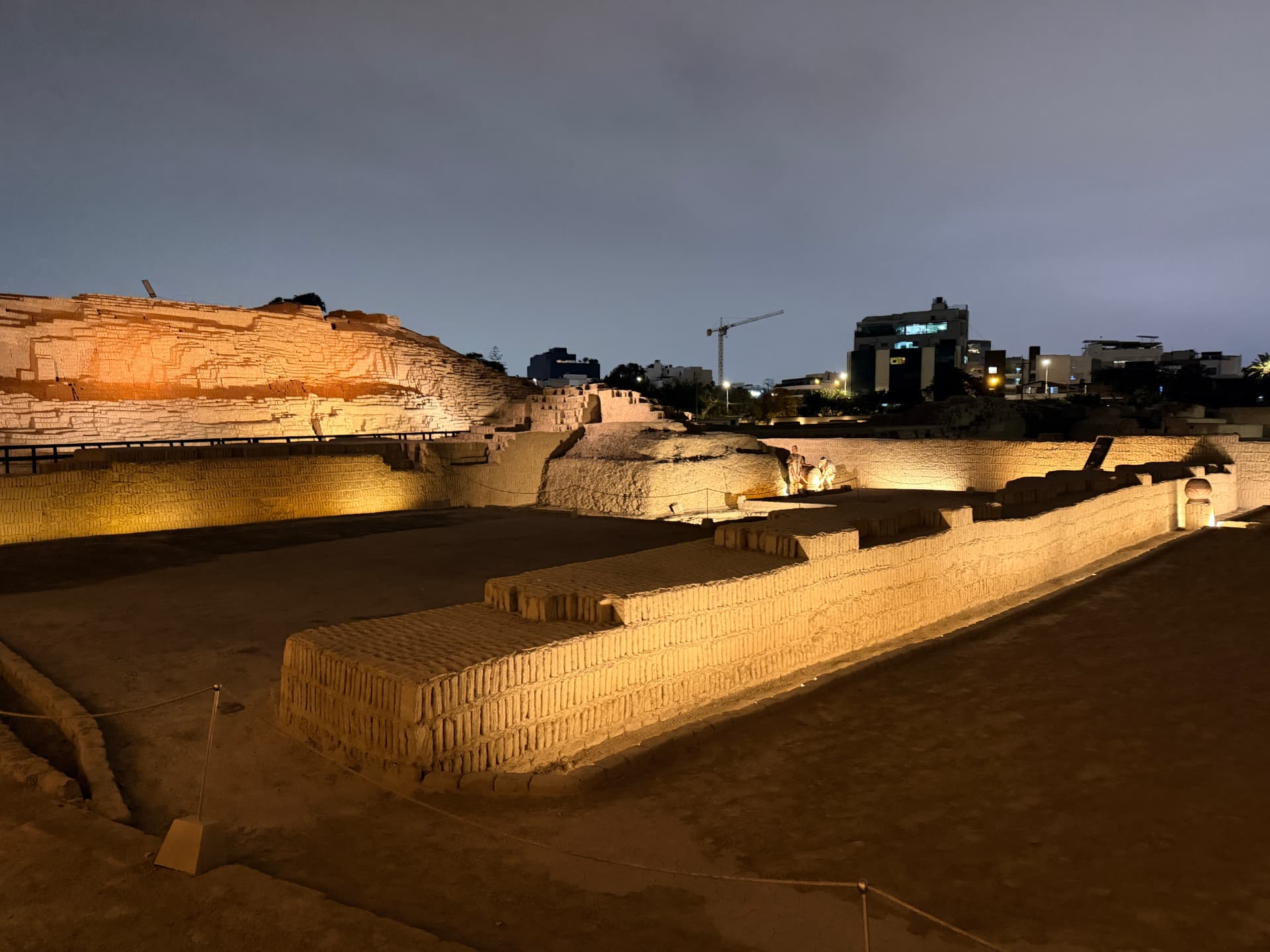 Huaca Pucllana adobe pyramid lit at night in Lima